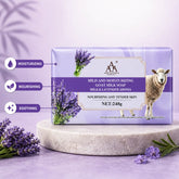 AA Goat Milk Triple Milled Soap with lavender and goat milk, displayed in a purple box on a stone pedestal with lavender flowers.