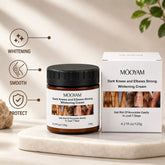 MOOYAM Dark Knees and Elbows Strong Whitening Cream in an amber jar with a black cap, displayed beside its white product box on a marble slab.