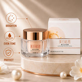 Whitening Freckle Cream 50g glass jar with rose gold lid and matching product box for reducing freckles, dark spots, and achieving an even skin tone