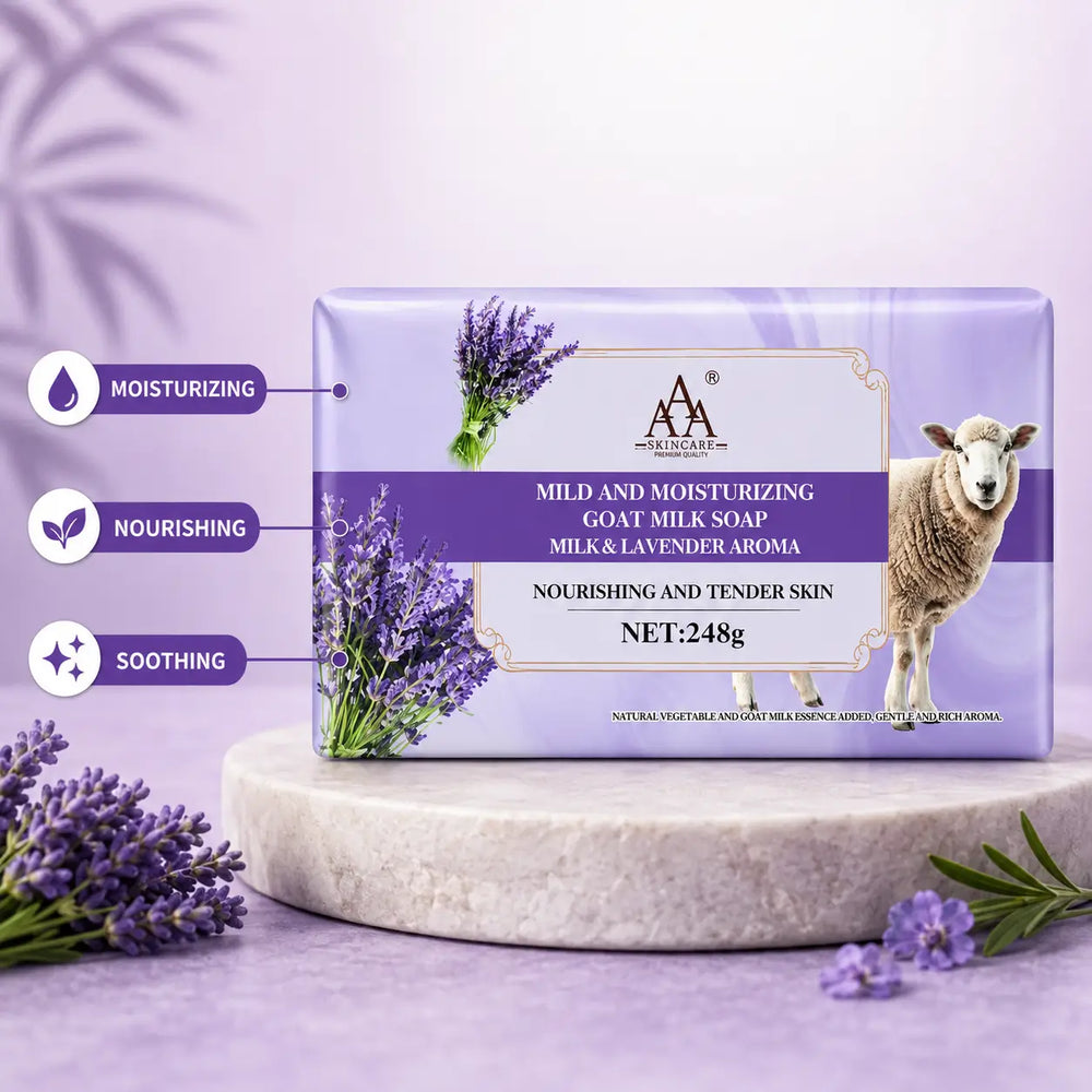 AA Goat Milk Triple Milled Soap with lavender and goat milk, displayed in a purple box on a stone pedestal with lavender flowers.