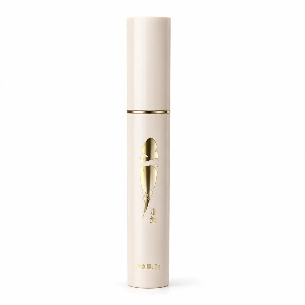 BCM O KOL slim cream-colored mascara tube with a metallic gold emblem and gold accent band on a white background.