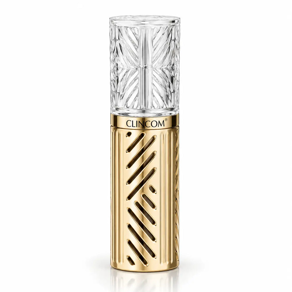 Clincom Golden Basis Cream cosmetic bottle with textured clear cap and gold finish