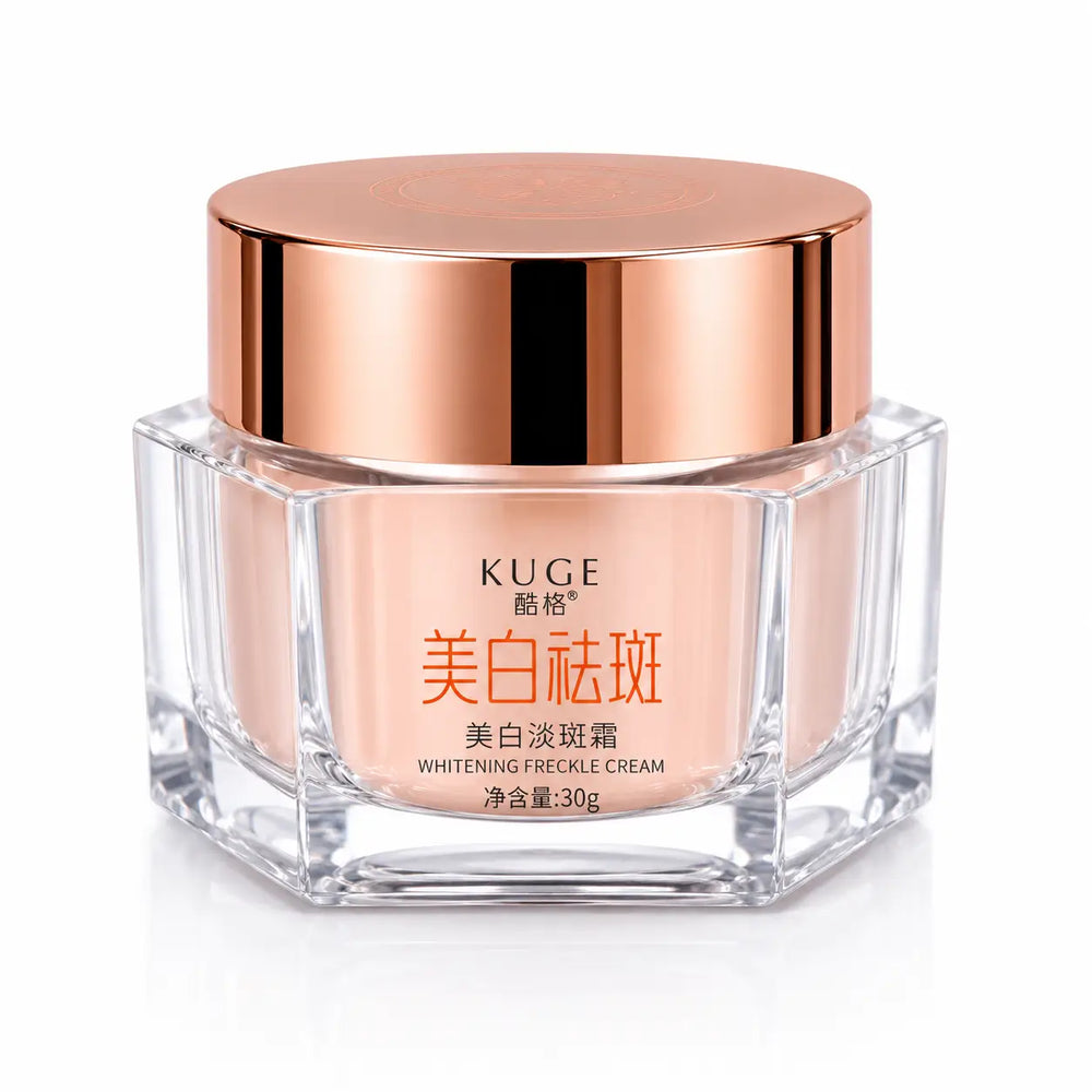 Front view of KUGE Whitening Freckle Cream 30g in a clear glass jar with a rose gold lid for reducing freckles, dark spots, pigmentation, and promoting an even skin tone.